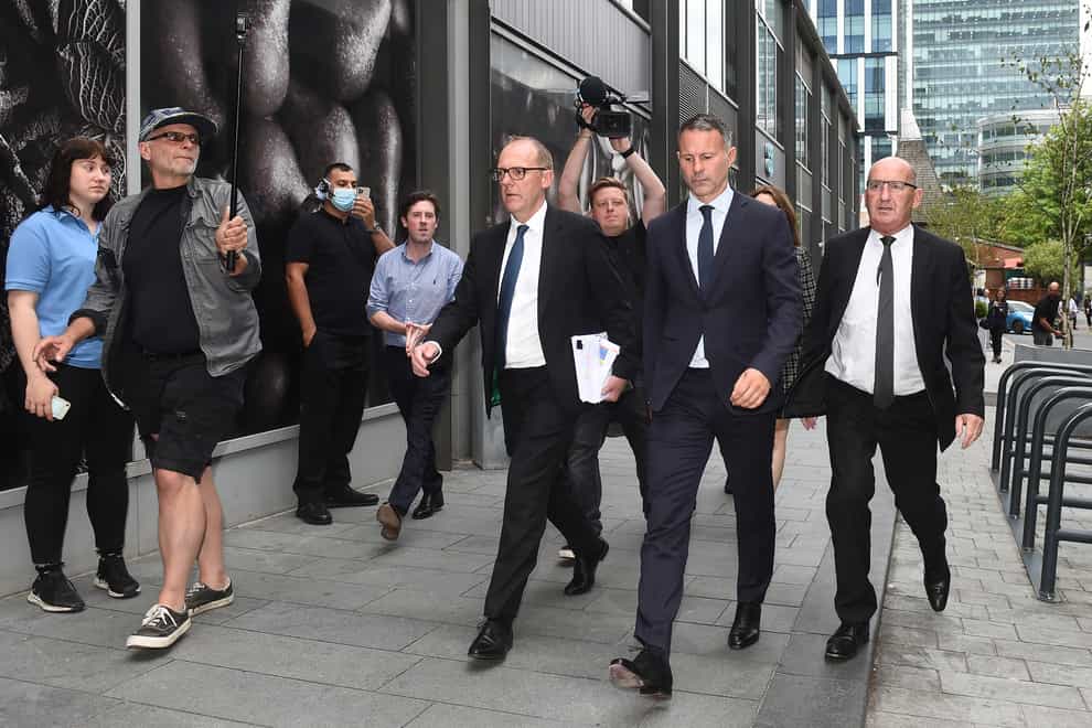 Former Manchester United footballer Ryan Giggs (second right) leaves Manchester Crown Court where he is accused of controlling and coercive behaviour against ex-girlfriend Kate Greville between August 2017 and November 2020. Picture date: Tuesday August 23, 2022.