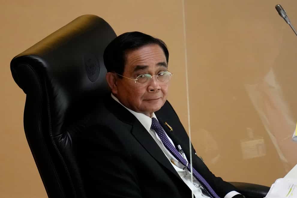 Thailand’s Constitutional Court has ruled that Prime Minister Prayuth must suspend his active duties while the court decides whether he has overstayed his legal term in office (Sakchai Lalit/AP)