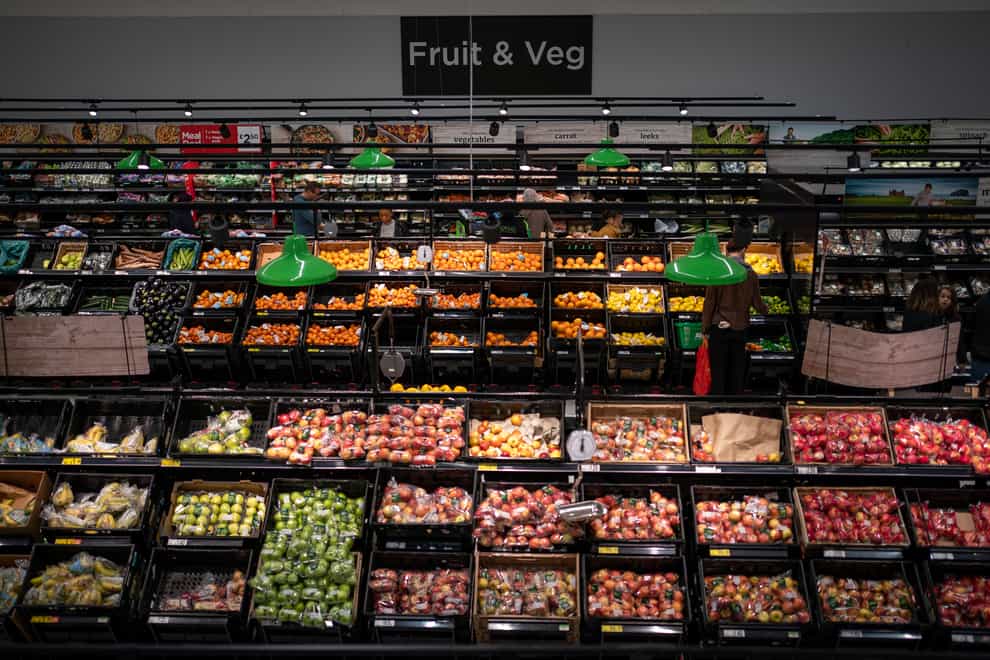 Shoppers in the fruit and vegetables section of a branch of Asda in south London (Aaron Chown/PA)