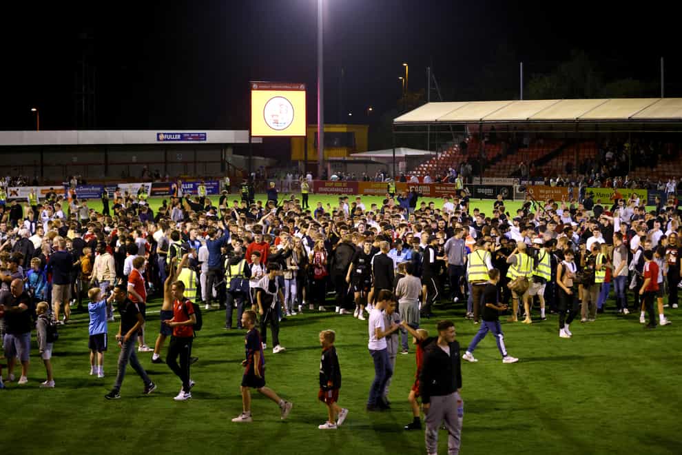 Crawley fans invaded the pitch following Tuesday’s Carabao Cup win over Fulham (Steven Paston/PA)