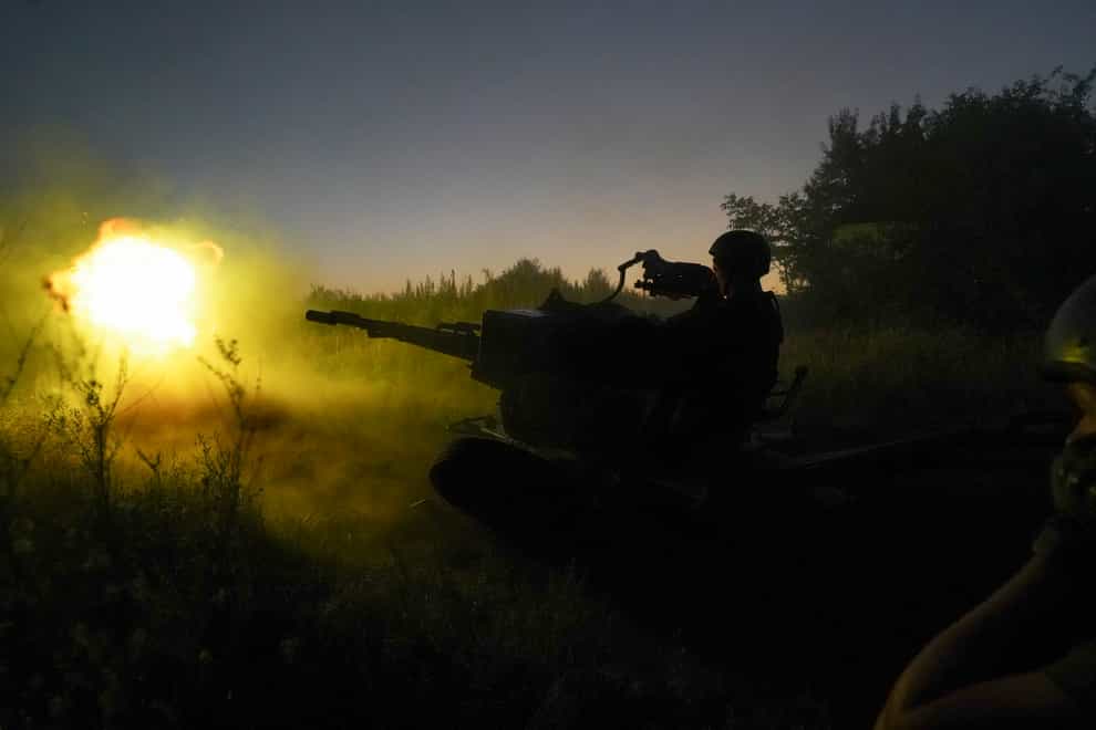 Ukrainian servicemen fire to Russian positions from anti-aircraft gun in the Kharkiv region of Ukraine (Andrii Marienko/AP)