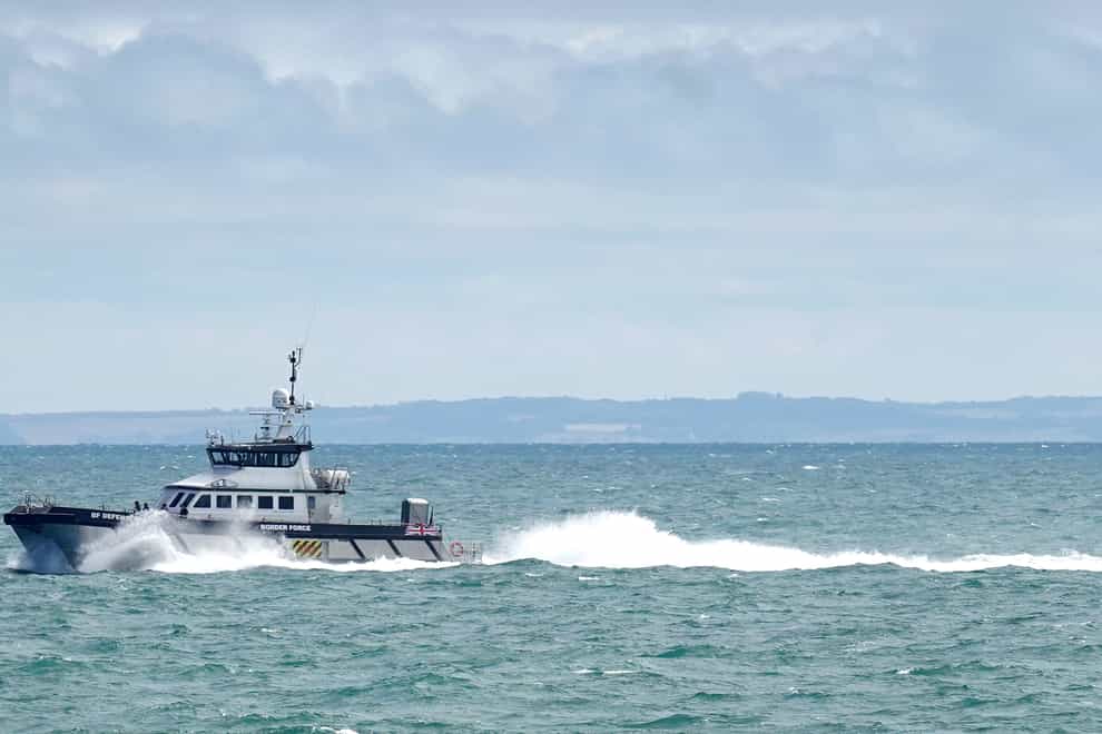 Border Force vessel Defender carries a group of people thought to be migrants in to Dover, Kent, following a small boat incident in the Channel. Picture date: Tuesday August 23, 2022. (Gareth Fuller/PA)