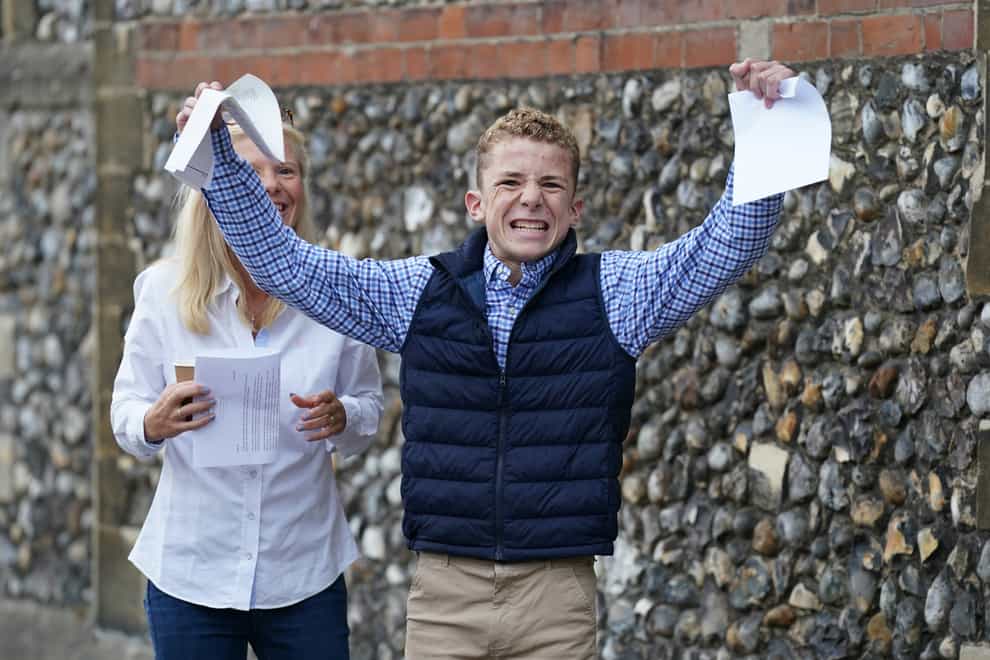 Finney Harrod receiving his GCSE results at Norwich School (Joe Giddens/PA)