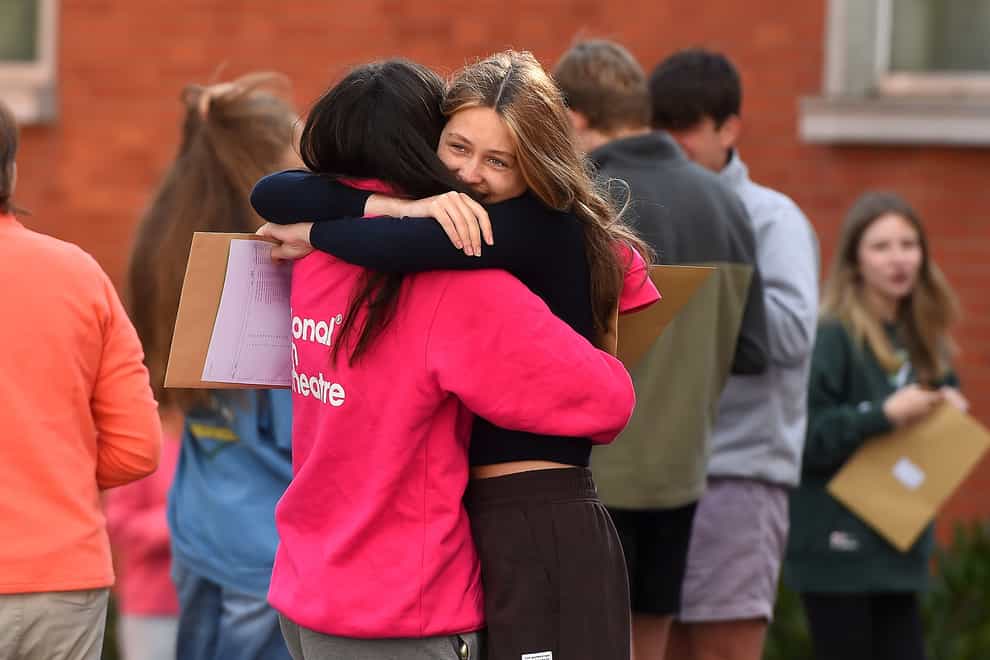 Pupils at Sullivan Upper School in Holywood, Co Down, celebrate after receiving their GCSE results (Oliver McVeigh/PA)