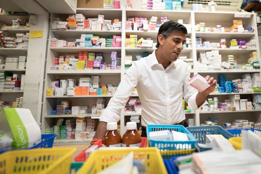 Rishi Sunak during a visit to his family’s old business, Bassett Pharmacy, in Southampton, Hampshire (PA)