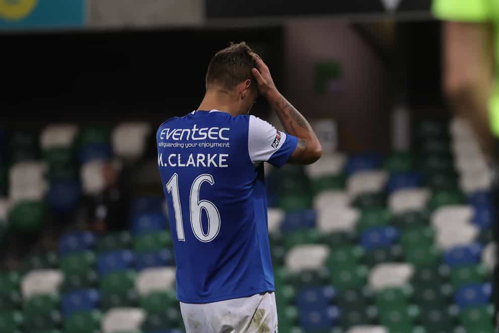 Linfield’s Matthew Clarke looks dejected after missing his penalty during the shootout of the Europa Conference League play-off match (Liam McBurney/PA)