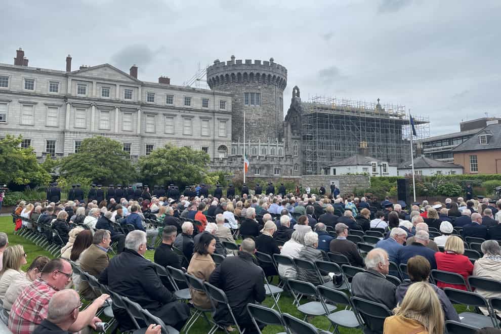 People attend the Garda Memorial event, an annual event to honour gardai who died in the course of their duty, at Dublin Castle, Ireland, in May (PA)