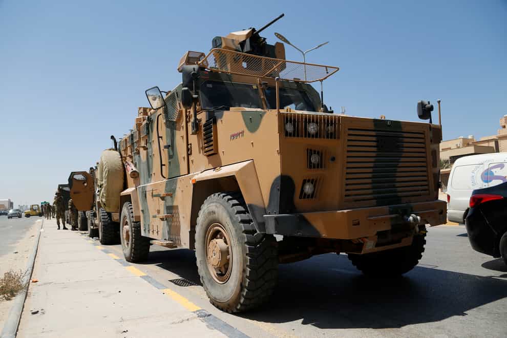 Libyan forces are deployed in Tripoli (Yousef Murad/AP)