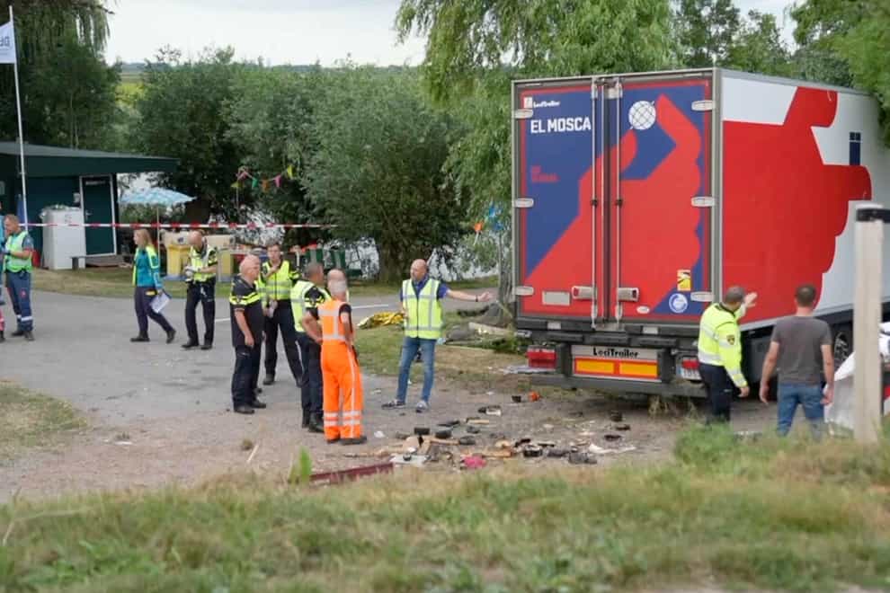 Policemen and rescue workers at the crash site in Nieuw-Beijerland (Media TV via AP)