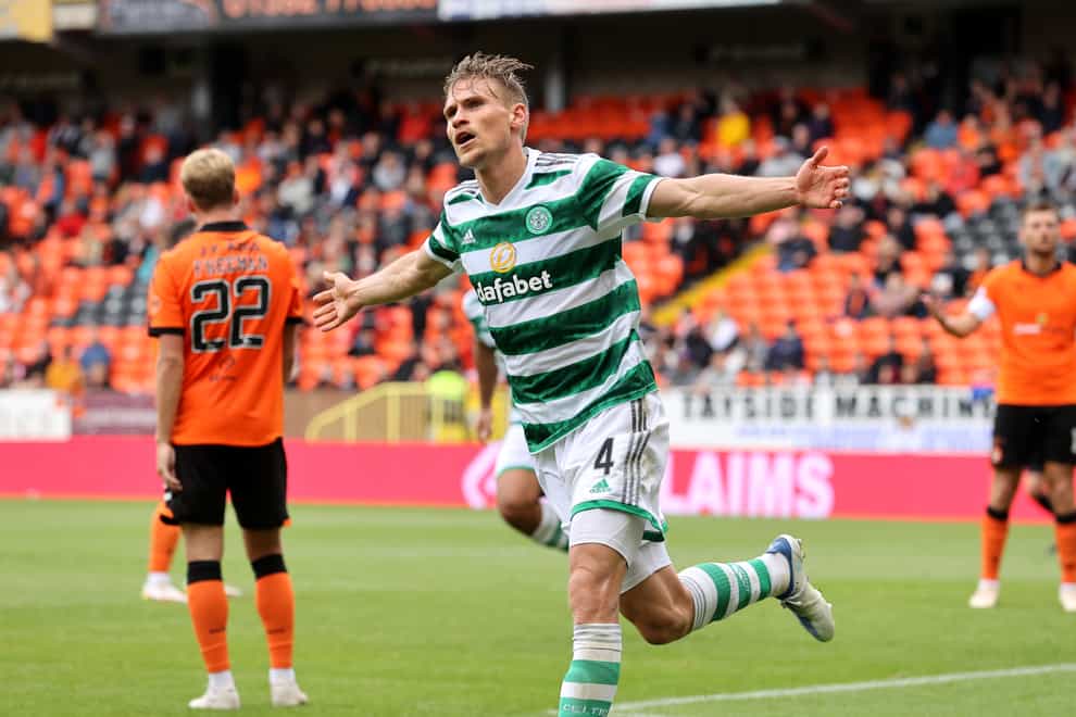 Carl Starfelt celebrated Celtic’s ninth goal, while Kieran Freeman and his Dundee United team-mates debated what went wrong (Steve Welsh/PA)