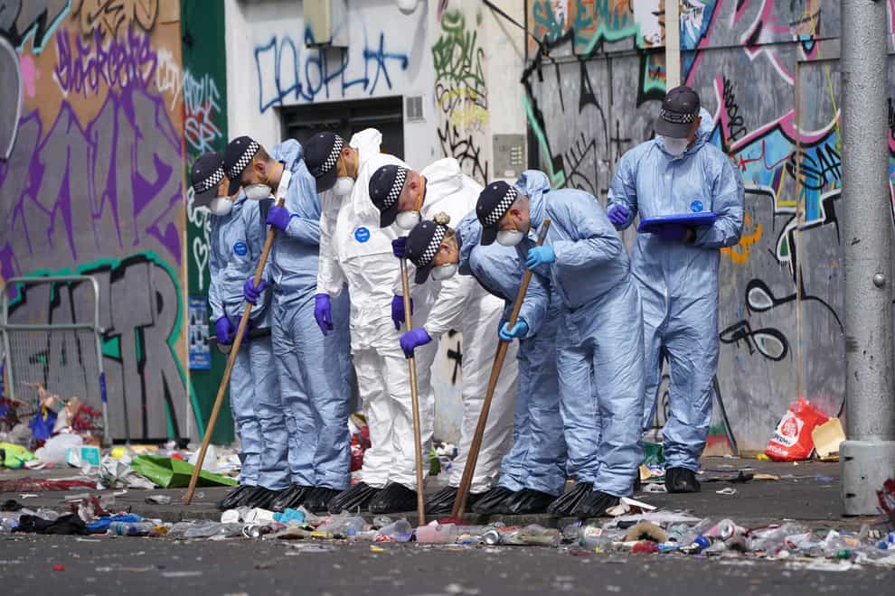 Forensics officers comb the scene in Ladbroke Grove, west London (Kirsty O’Connor/PA)