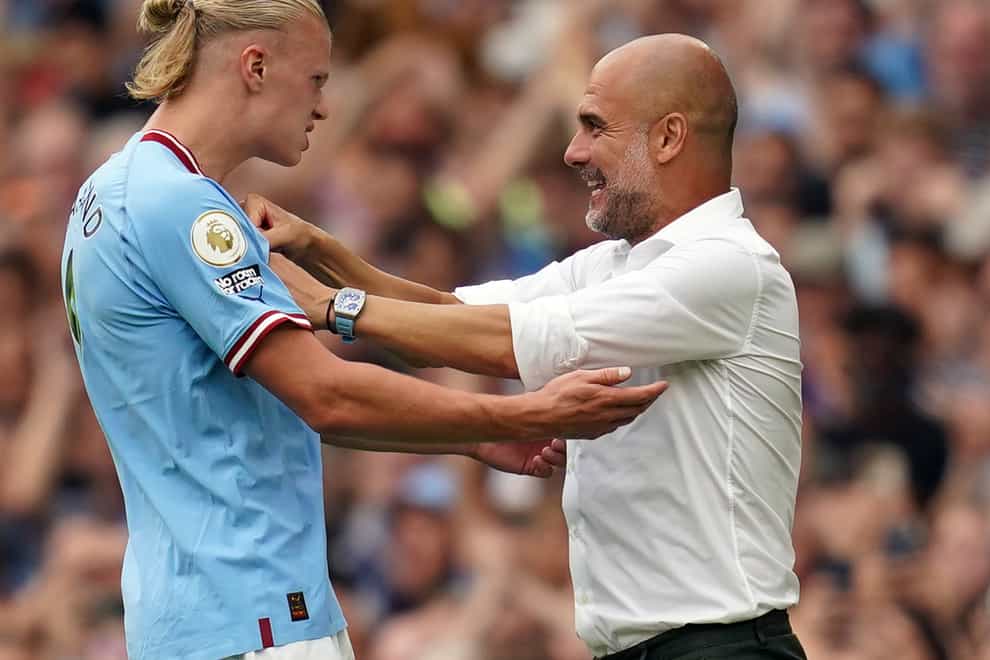 Manchester City’s Erling Haaland, left, could be rested by Pep Guardiola, right (Nick Potts/PA)