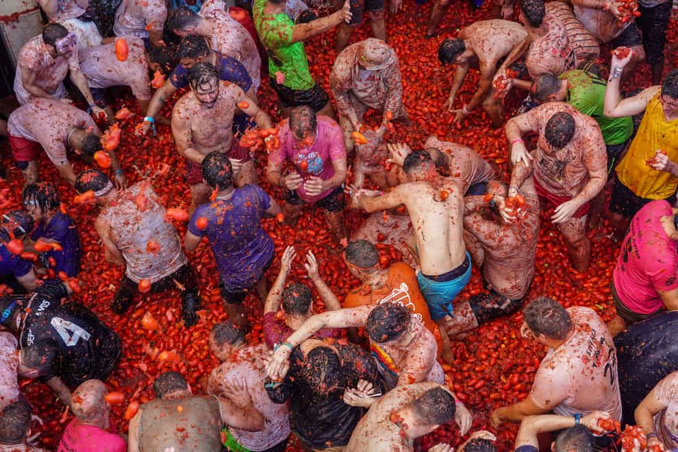 Revellers throw tomatoes at each other during the festivities in Bunol (Alberto Saiz/AP)