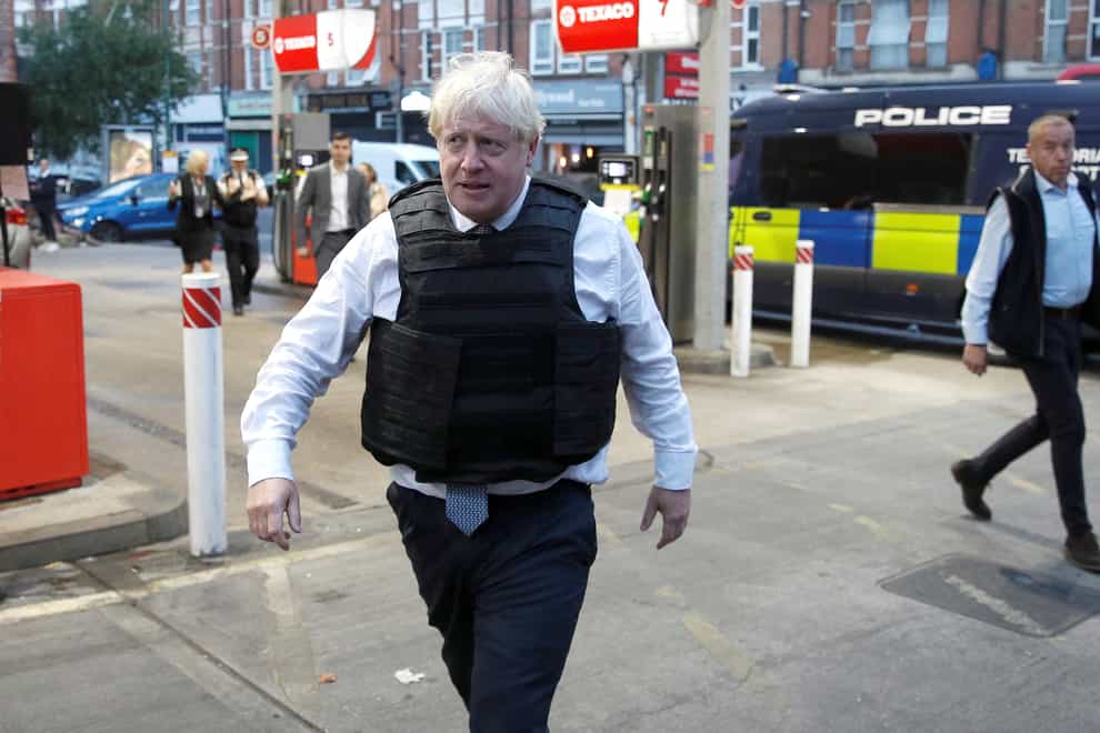 A video posted on social media appears to show Boris Johnson during a police raid speaking with a man already in the property