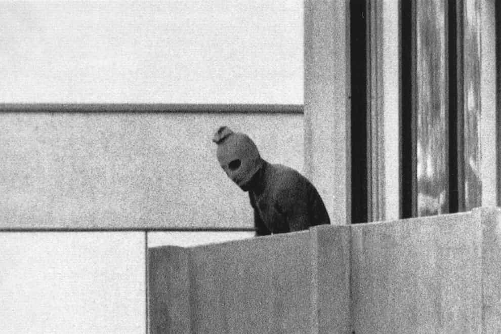 An Arab Commando stands on the balcony of the building where the commandos held members of the Israeli team hostage in Munich on September 5 1972 (Kurt Strumpf/AP)