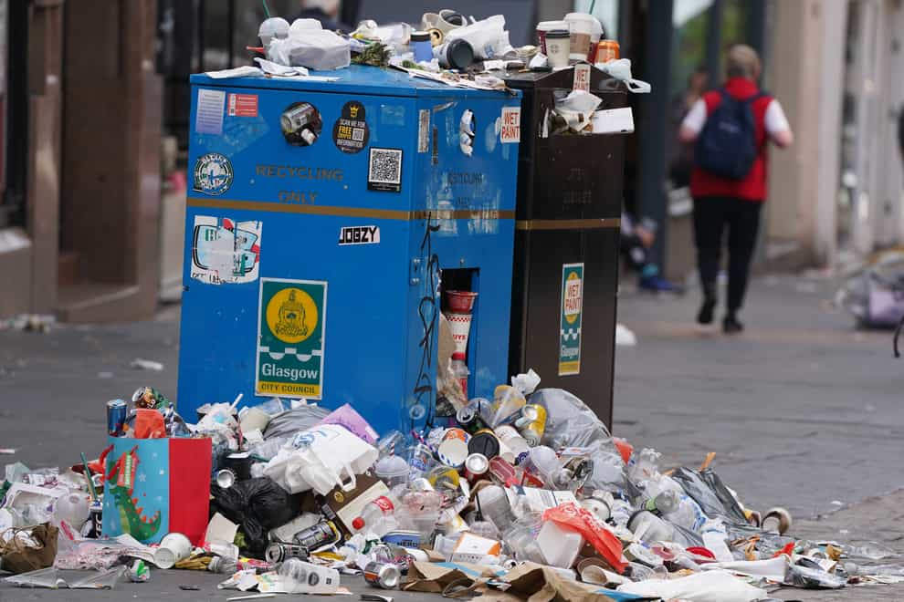 Mountains of rubbish have piled up in city centres (Andrew Milligan/PA)