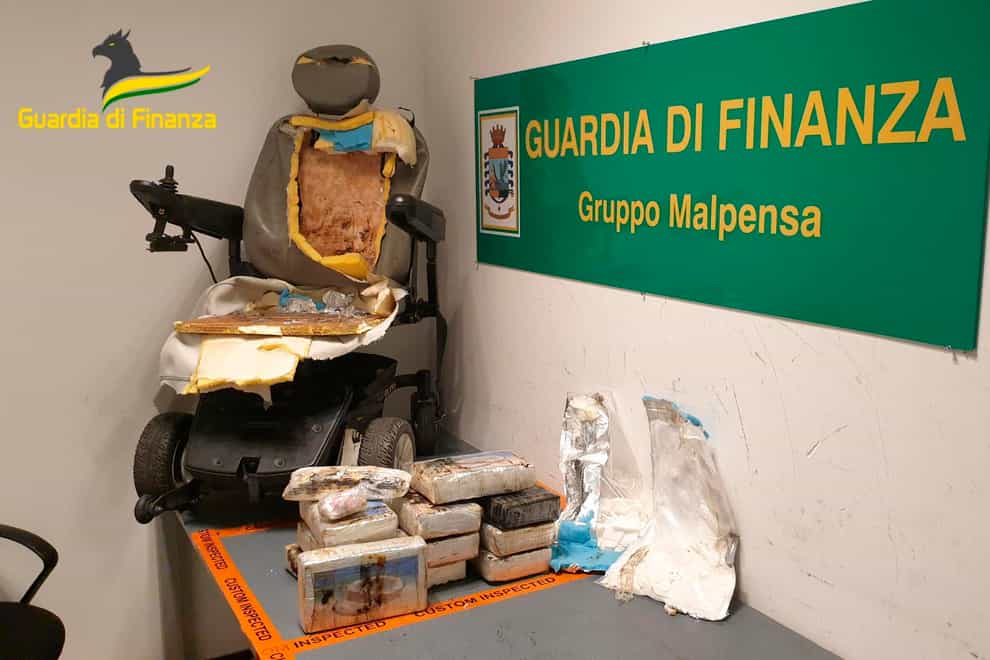 A ‘disabled’ man started walking – and was arrested – at a Milan airport after a sniffer dog tipped police off to 13kg of cocaine hidden inside his wheelchair’s leather upholstery (Guardia di Finanza/AP)