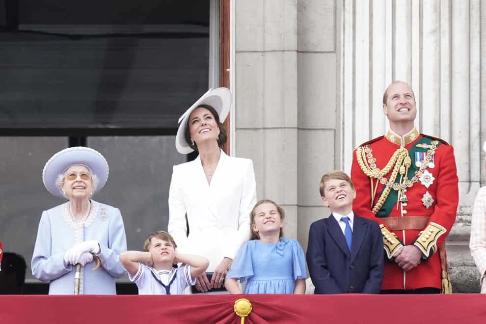 File photo dated 02/06/22 of (left to right) Queen Elizabeth II, Prince Louis, the Duchess of Cambridge, Princess Charlotte, Prince George, and the Duke of Cambridge, on the balcony of Buckingham Palace, to view the Platinum Jubilee flypast. The Duke and Duchess of Cambridge are to embark on the next major phase of their life by moving their family to Windsor, with Prince George, Princess Charlotte and Prince Louis all starting at the same new school.