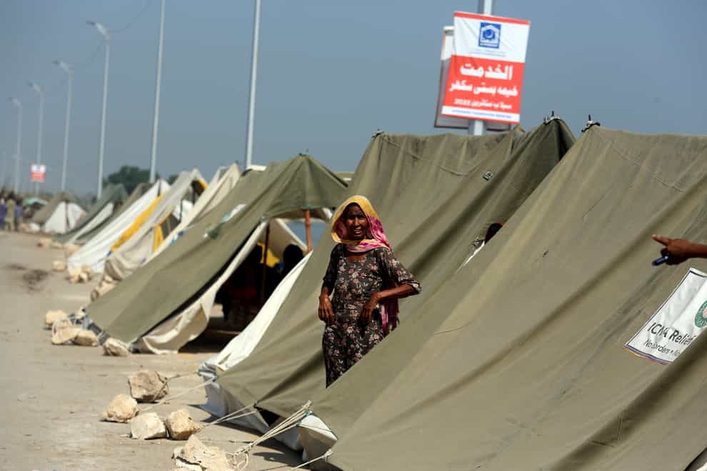A woman among millions displaced to relief camps amid unprecedented flooding in Pakistan (Fareed Khan/AP)