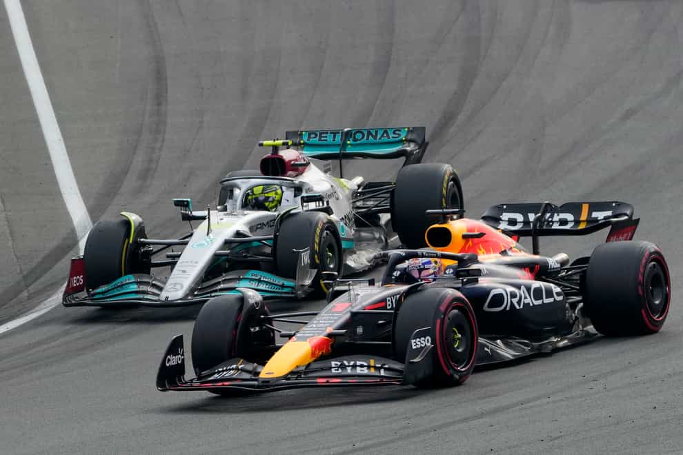 Red Bull driver Max Verstappen. right, overtakes Lewis Hamilton (Peter Dejong/AP)