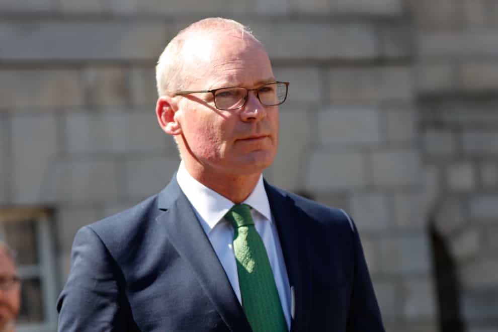 Irish Foreign Minister Simon Coveney arrives for the National Day of Commemoration Ceremony, held to honour all Irishmen and Irishwomen who died in past wars or on service with the United Nations, at Collins Barracks in Dublin. Picture date: Sunday July 10, 2022.