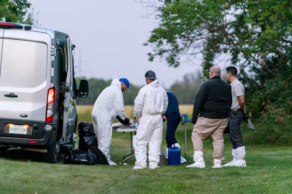 Investigators near the scene of a stabbing in Weldon, Saskatchewan (Heywood Yu/The Canadian Press/AP)