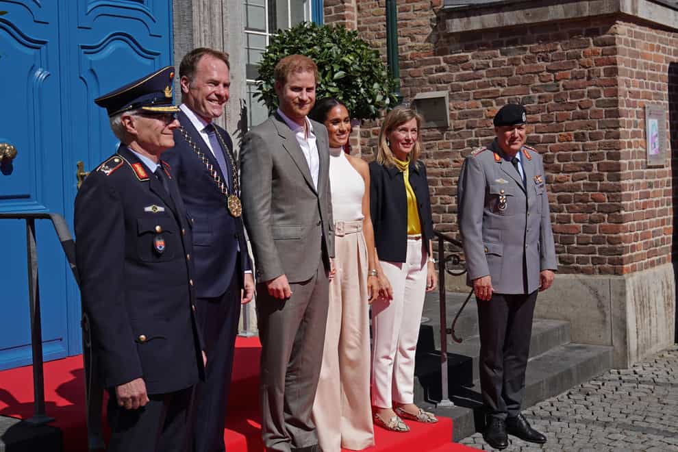The Duke and Duchess of Sussex (centre) arrive at City Hall for the Invictus Games Dusseldorf 2023 One Year to Go event (Joe Giddens/PA)