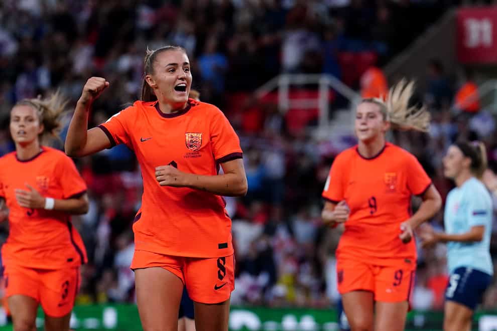 Georgia Stanway celebrates her opener, pursued by fellow goalscorers Rachel Daly, left, and Alessia Russo (Martin Rickett/PA)