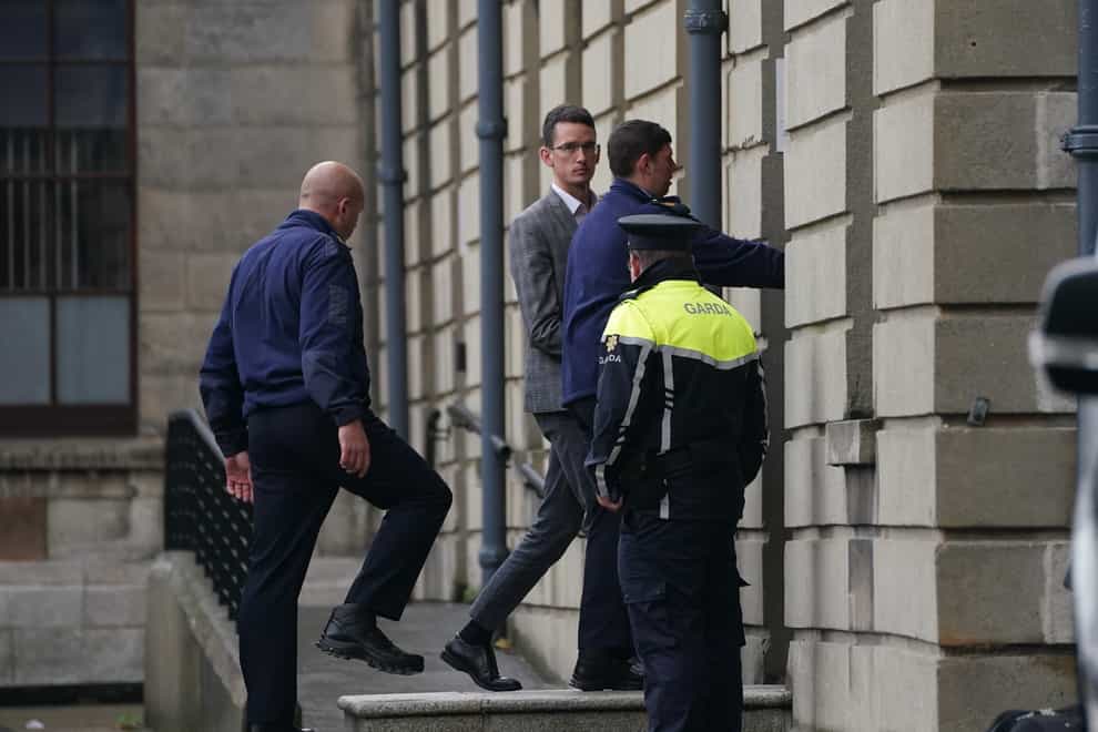 Irish schoolteacher Enoch Burke (centre) arriving at the High Court, Dublin (Brian Lawless/PA)