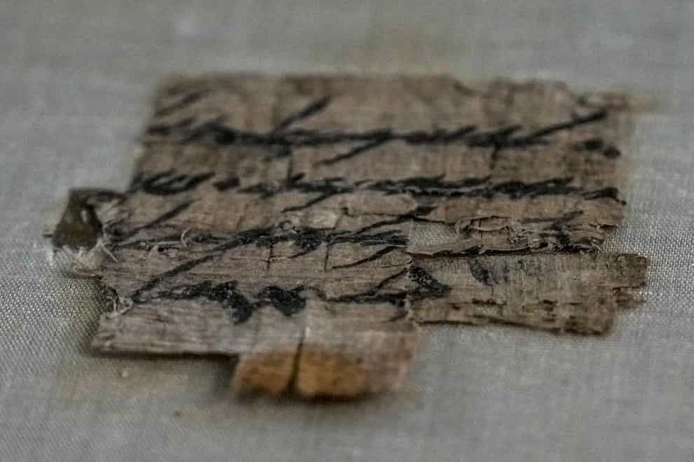 The scrap of papyrus is displayed at the Israeli Antiquities Authority (Ariel Schalit/AP)