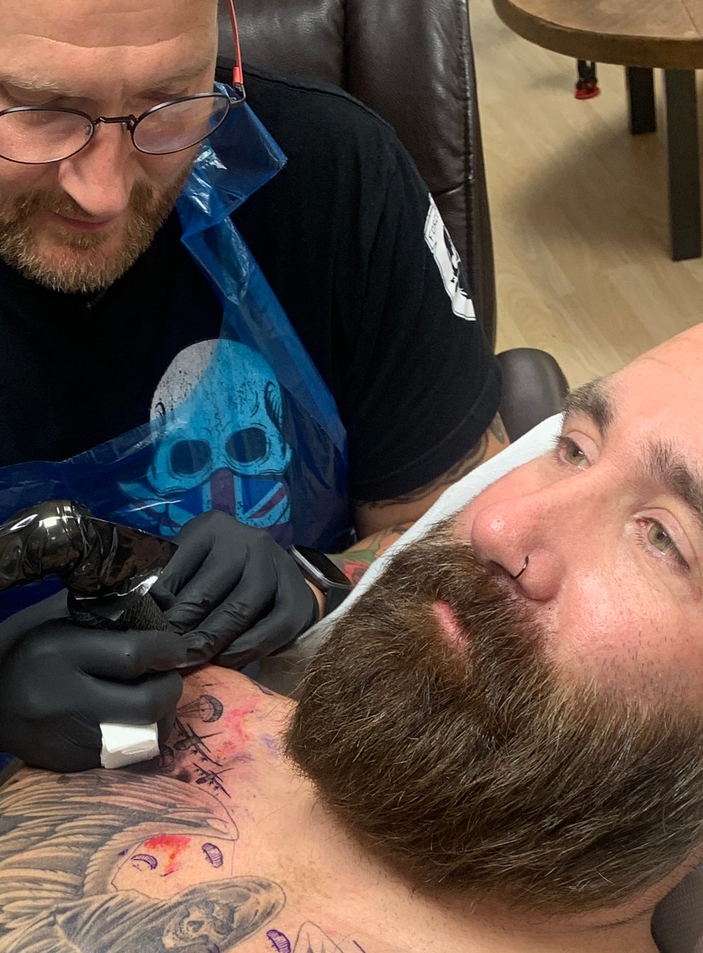 Tattoo artist Aaron Baillie working on veteran Scottie Lovegrove (Help for Heroes/PA)