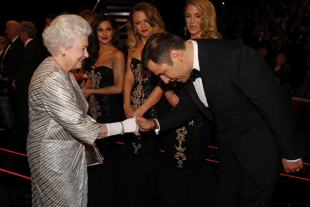 Queen Elizabeth II greets comedian David Walliams after the Royal Variety Performance at the Royal Albert Hall in London (PA)