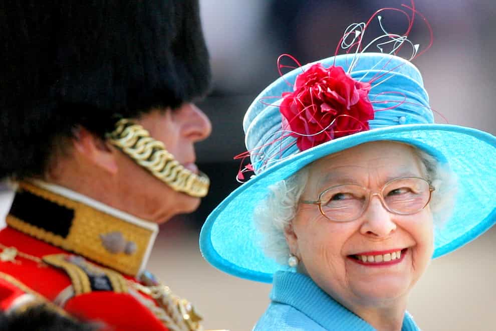 The Queen smiles at the Duke of Edinburgh on Horse Guards Parade during the annual Trooping the Colour parade (Lewis Whyld/PA)