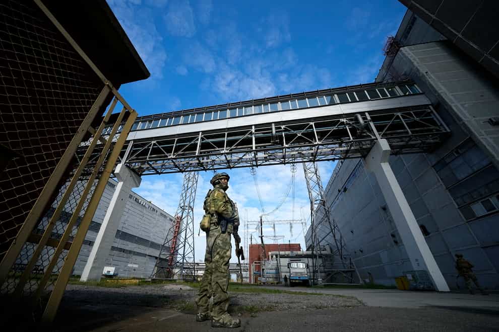 A Russian serviceman guards an area of the Zaporizhzhia nuclear power station in territory under Russian military control in south-eastern Ukraine in May (AP)