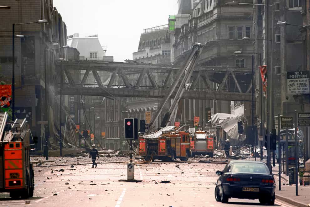 Firemen at the scene of the IRA bomb blast in Manchester city centre (PA)