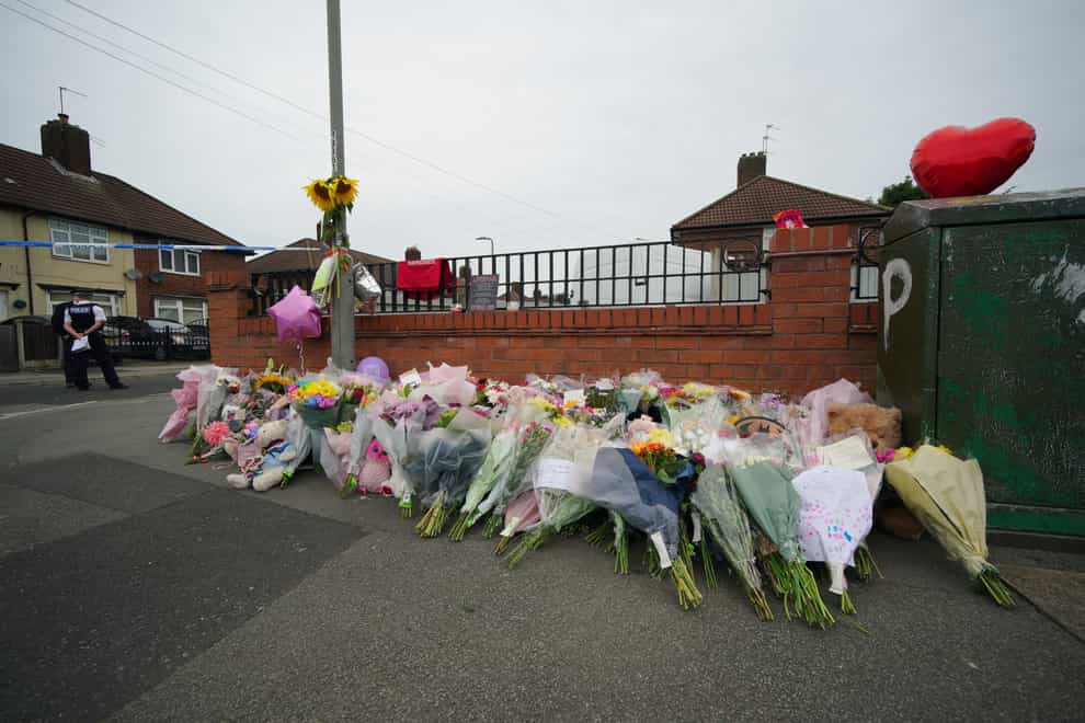 Flowers are left near to the scene of an incident in Kingsheath Avenue, Knotty Ash, Liverpool, where nine-year-old Olivia Pratt-Korbel was fatally shot (Peter Byrne/PA)