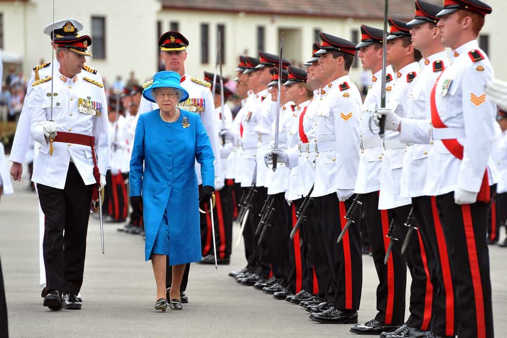 The Queen inspecting the Guard of Honour during the ceremony of presentation of the new colours to the Australian Royal Military College at Duntroon in Canberra, Australia, in 2011 (John Stillwell/PA)