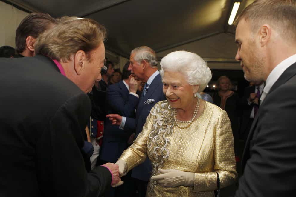 The Queen meets Sir Andrew Lloyd Webber – now Lord Andrew Lloyd-Webber – in 2012 (Dave Thompson/PA)