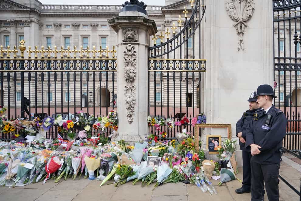 Flowers outside Buckingham Palace in London (Dominic Lipinski/PA)
