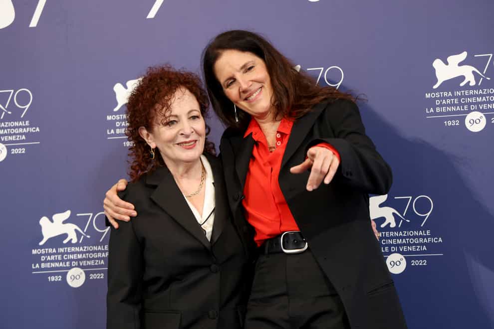 Nan Goldin, left, and director Laura Poitras pose for photographers (Vianney Le Caer/Invision/AP)