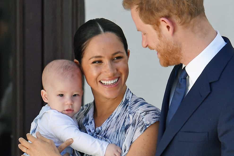 Harry, Meghan and Archie as a baby (Toby Melville/PA)