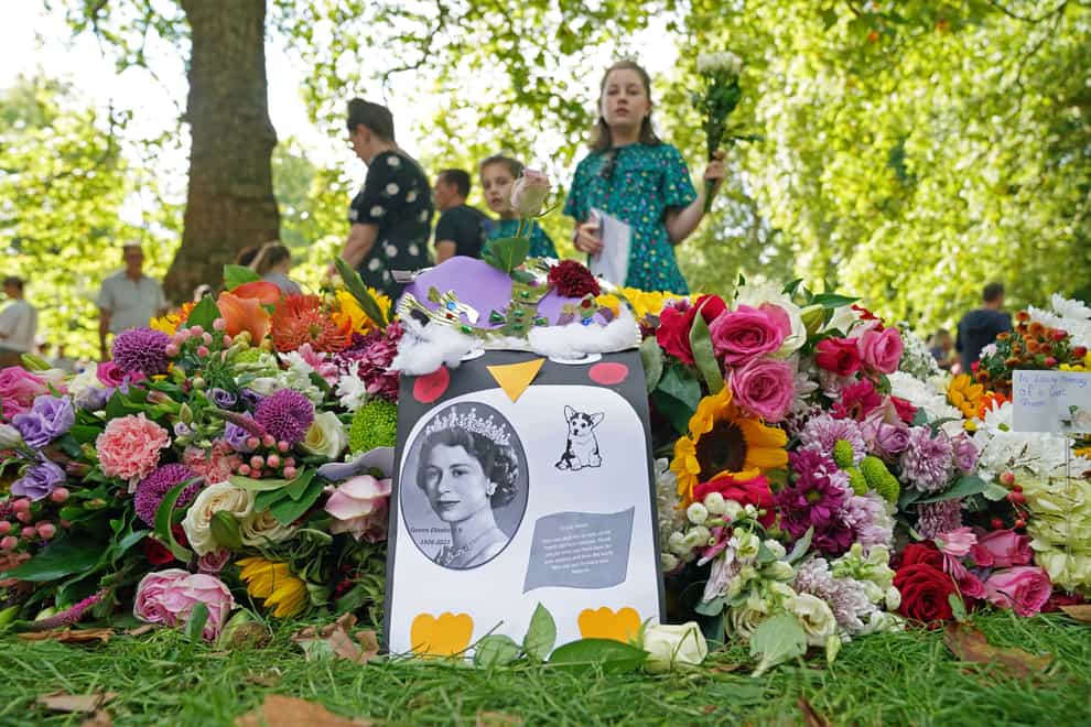 Members of the public have been leaving emotional tributes to the Queen across the country (Jonathan Brady/PA)