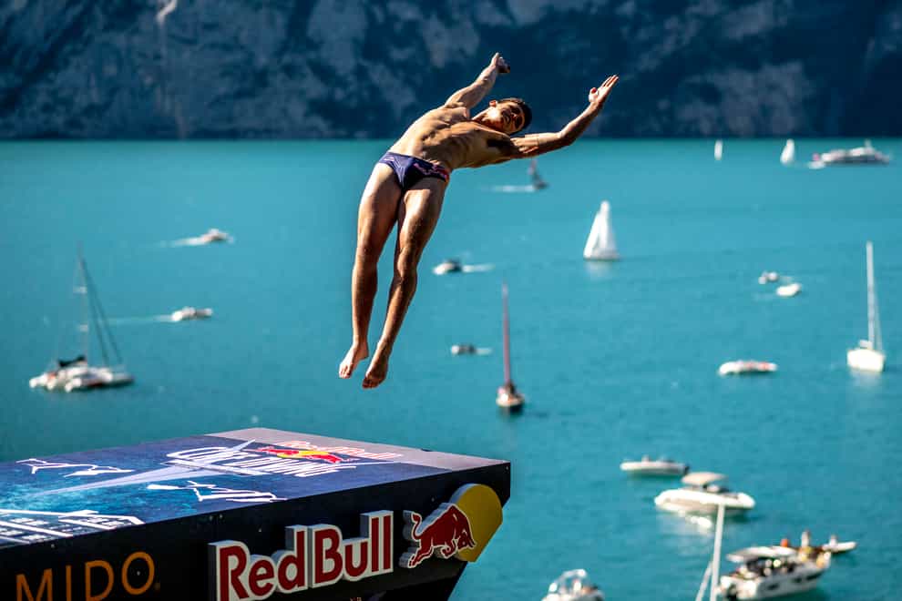 Aidan Heslop of the UK dives from the 27-metre platform during the final competition day of the sixth stop of the Red Bull Cliff Diving World Series in Sisikon, Switzerland (Romina Amato/Red Bull/PA)