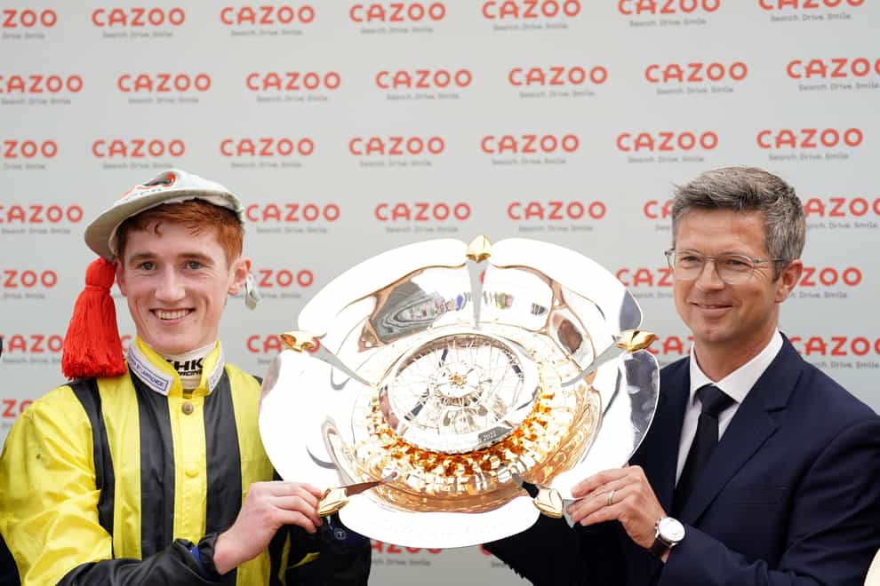 David Egan and Roger Varian lift the trophy after winning the Cazoo St Leger Stakes with Eldar Eldarov at Doncaster Racecourse. Picture date: Sunday September 11, 2022.
