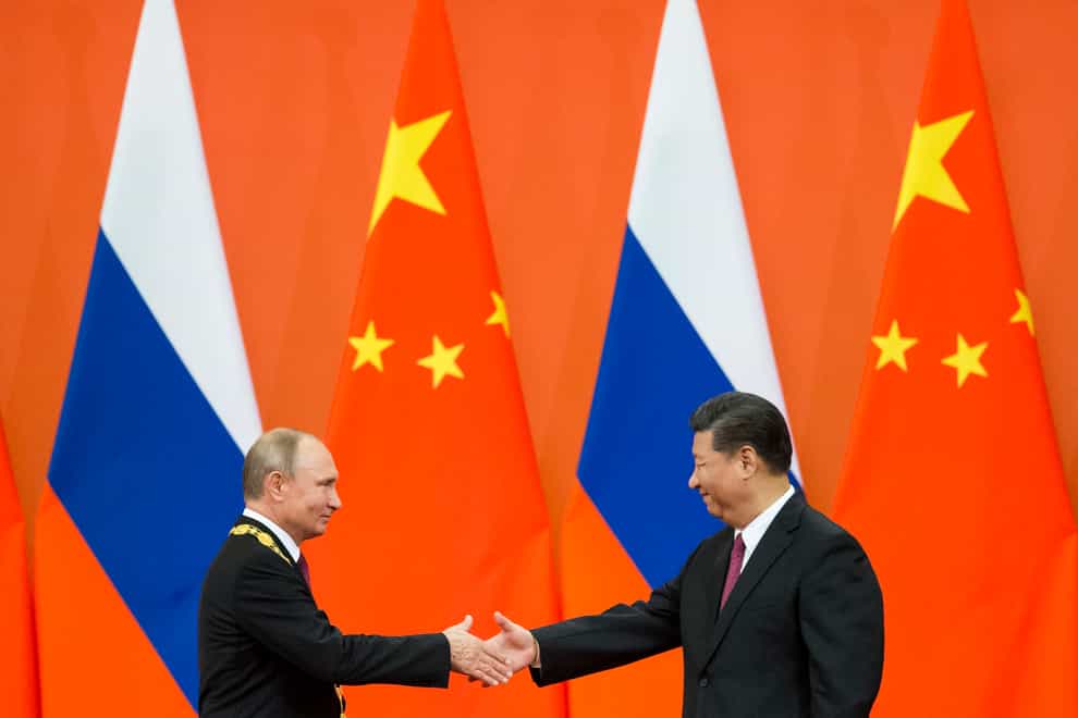 Russian leader Vladimir Putin and Chinese President Xi Jinping (AP)
