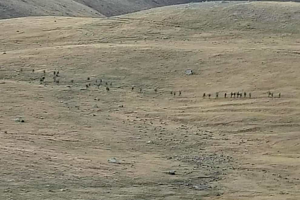 A screengrab purportedly showing Azerbaijanian servicemen crossing the Armenian-Azerbaijani border and approaching Armenian positions (Armenian defence ministry via AP)