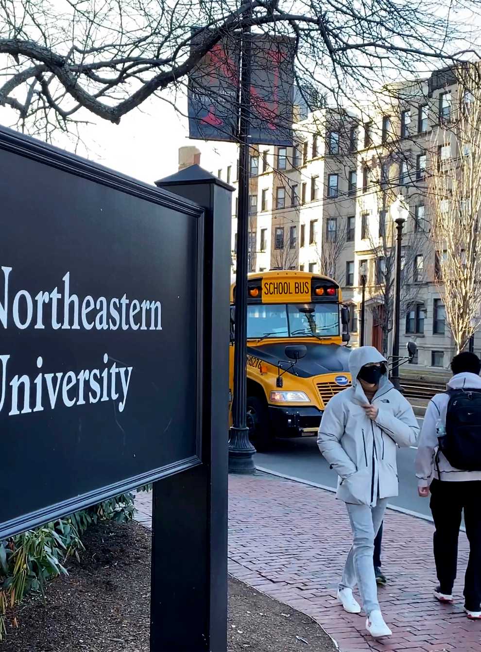 Students walk on the Northeastern University campus in Boston (Rodrique Ngowi/AP)