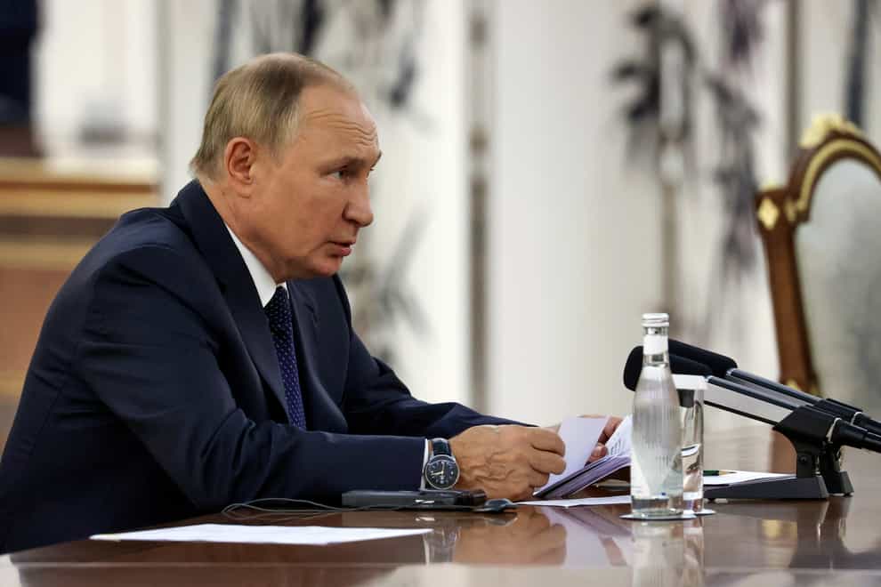 Russian President Vladimir Putin talks to Chinese President Xi Jinping (Alexandr Demyanchuk, Sputnik/Kremlin Pool Photo/AP)