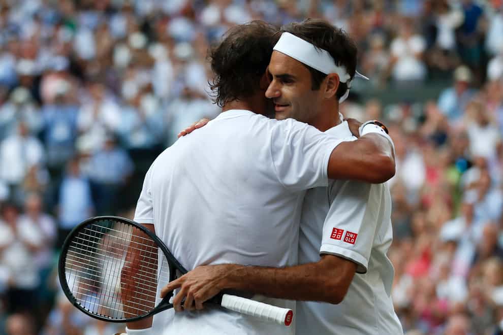 <p>Roger Federer (right) and Rafael Nadal embrace after their last meeting at Wimbledon in 2019 (Adrian Dennis/PA)</p>