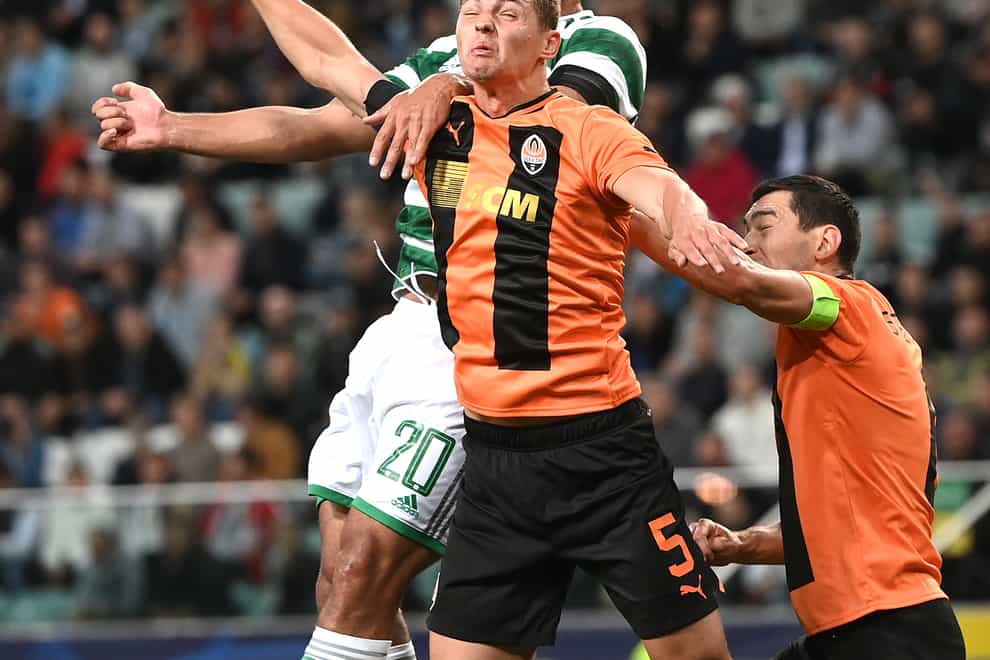 Celtic’s Cameron Carter-Vickers (and Shakhtar Donetsk’s Valeriy Bondar battle for the ball (Rafal Oleksiewicz/PA)
